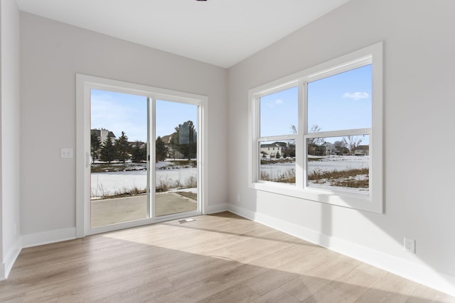 unfurnished room featuring light hardwood / wood-style floors