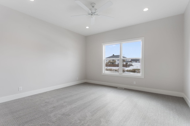 carpeted empty room with ceiling fan