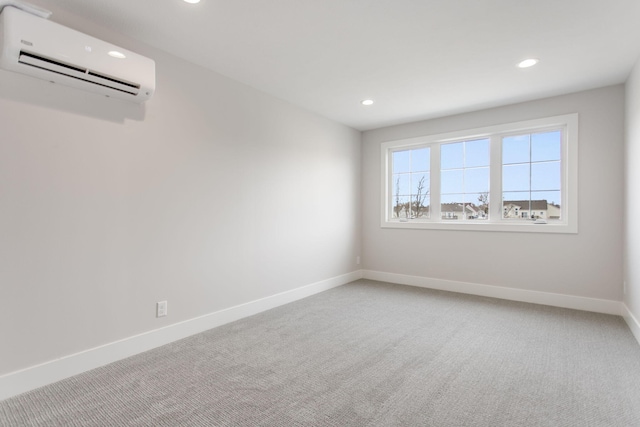 carpeted empty room featuring an AC wall unit