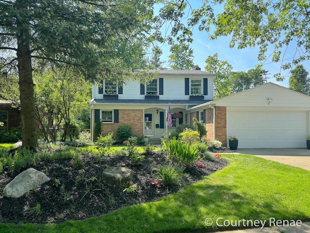 traditional home featuring driveway, covered porch, an attached garage, a front yard, and brick siding