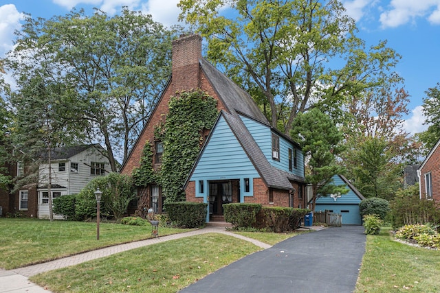 view of front of home featuring a garage and a front yard