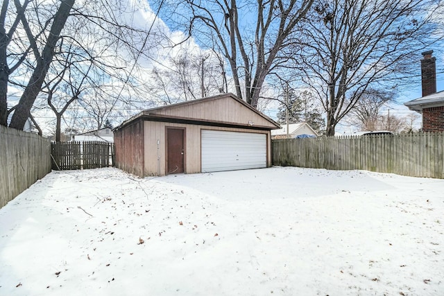 view of snow covered garage