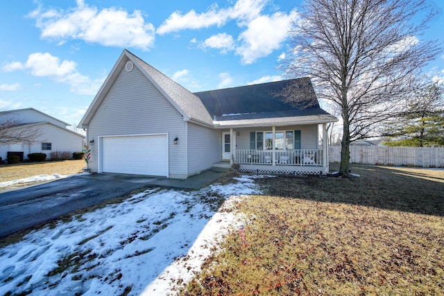 single story home featuring a porch, fence, a garage, and aphalt driveway