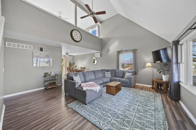 living room with dark wood-style floors, baseboards, and visible vents