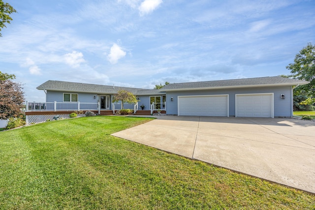 ranch-style home featuring a front lawn and a garage