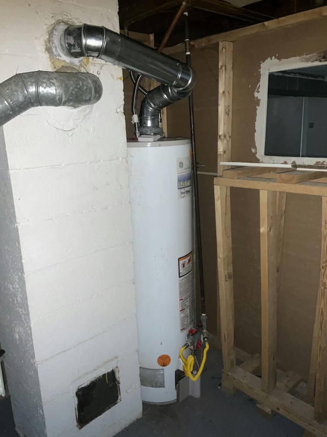 utility room featuring water heater