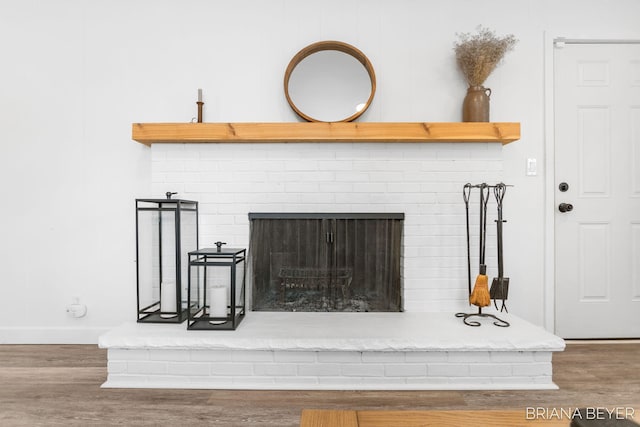 details featuring a fireplace and hardwood / wood-style flooring