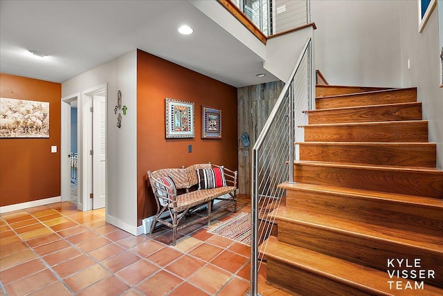 staircase with tile patterned floors