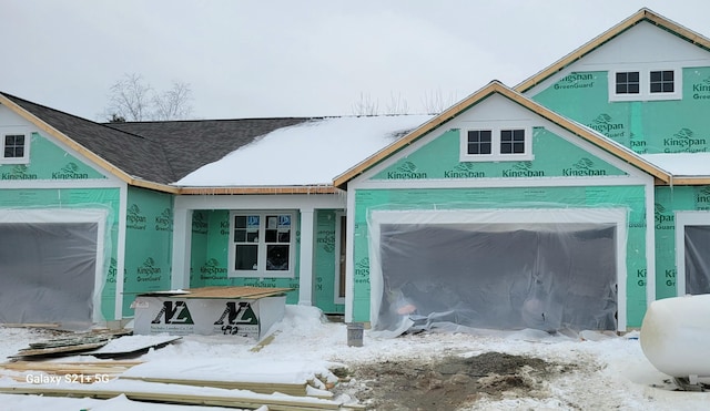 view of snow covered garage