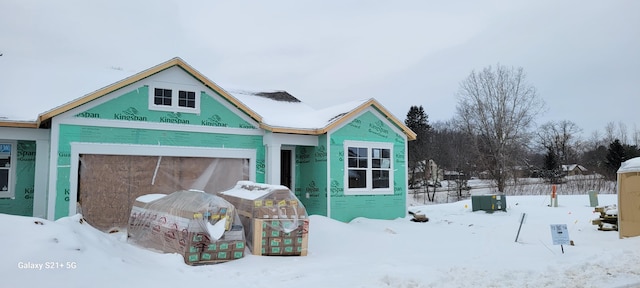 property in mid-construction with an attached garage