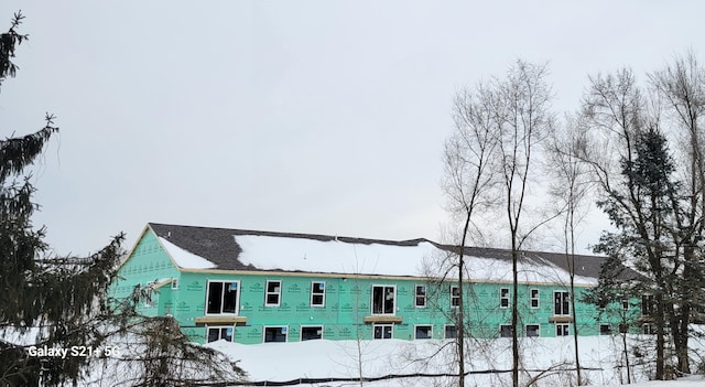 view of snow covered property