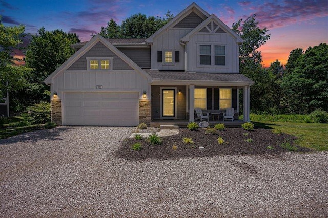 view of front of home with a garage and covered porch