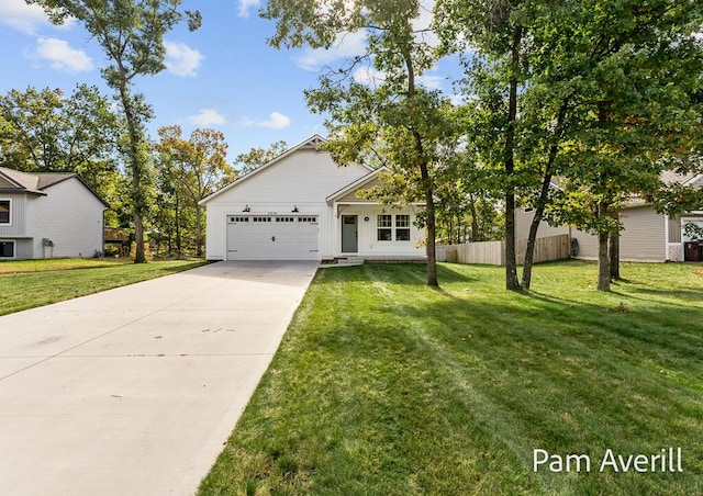 view of front of home featuring a garage and a front lawn