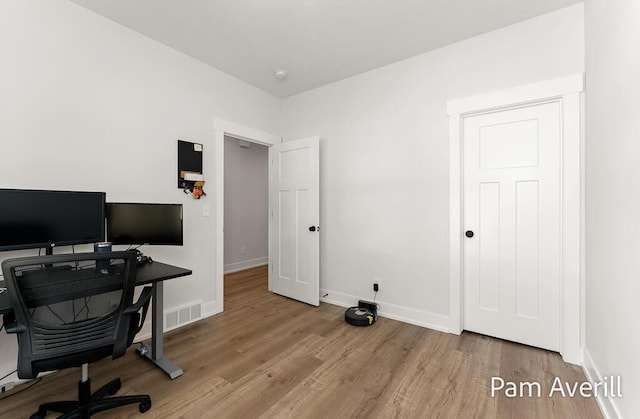 office area with light wood-type flooring