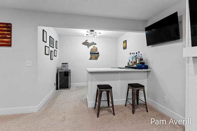 bar with wine cooler and light colored carpet