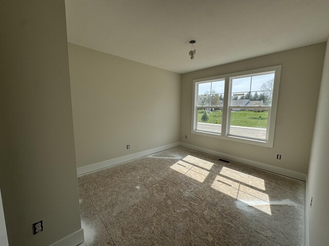 275 Hickory Valley Dr, Kalamazoo, MI 49009 - unfurnished room with baseboards, carpet flooring, and visible vents
