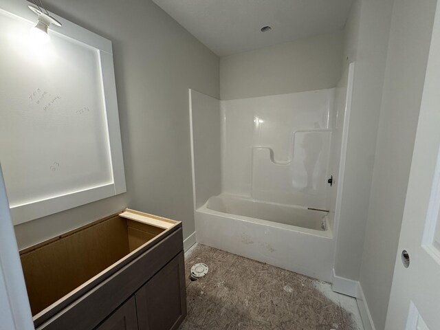 275 Hickory Valley Dr, Kalamazoo, MI 49009 - bathroom with baseboards and shower / bathtub combination