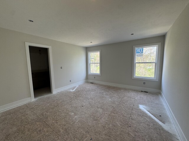 275 Hickory Valley Dr, Kalamazoo, MI 49009 - empty room with baseboards and visible vents