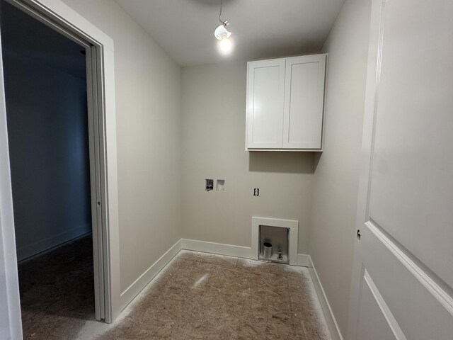 275 Hickory Valley Dr, Kalamazoo, MI 49009 - laundry room featuring light colored carpet, washer hookup, cabinet space, and baseboards