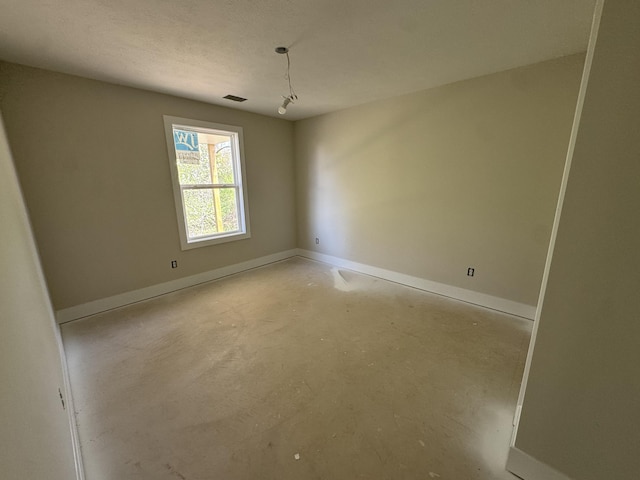 275 Hickory Valley Dr, Kalamazoo, MI 49009 - unfurnished room featuring baseboards, visible vents, and concrete floors