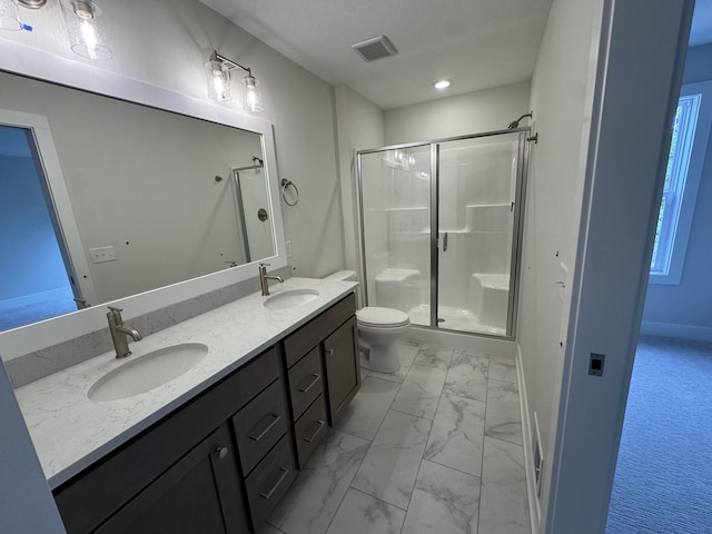 275 Hickory Valley Dr, Kalamazoo, MI 49009 - full bathroom with marble finish flooring, a stall shower, double vanity, and toilet