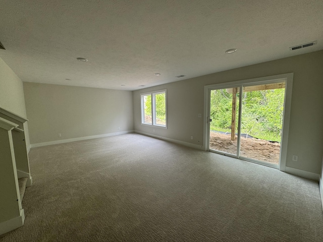275 Hickory Valley Dr, Kalamazoo, MI 49009 - empty room with baseboards, carpet flooring, and a textured ceiling