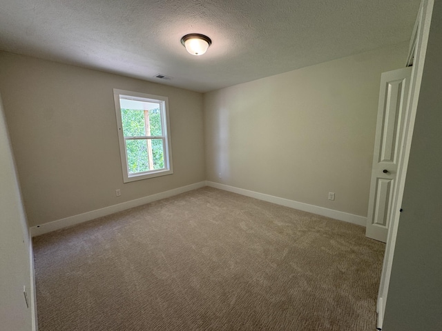 275 Hickory Valley Dr, Kalamazoo, MI 49009 - empty room with light colored carpet, baseboards, and a textured ceiling