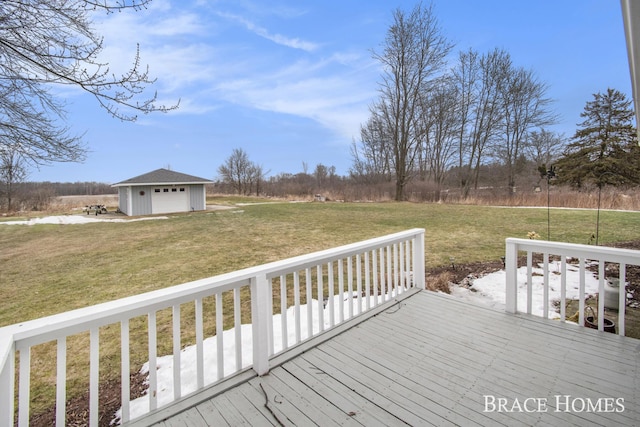 wooden deck featuring a garage, an outdoor structure, and a yard