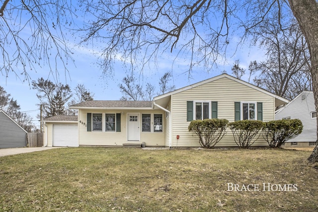 view of front of house with driveway, a front lawn, an attached garage, and fence