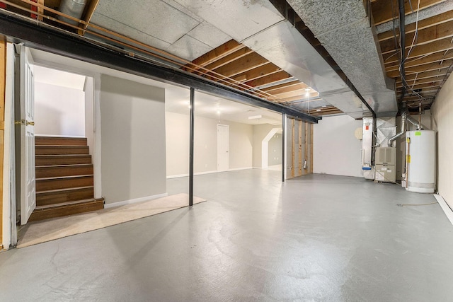 basement featuring water heater and heating unit