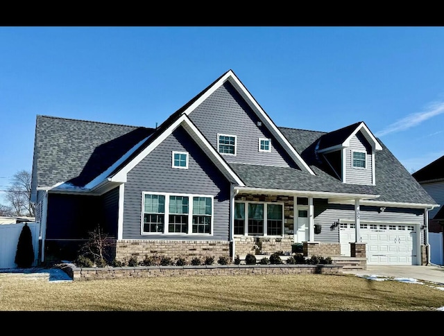 exterior space with a garage, a lawn, and a porch