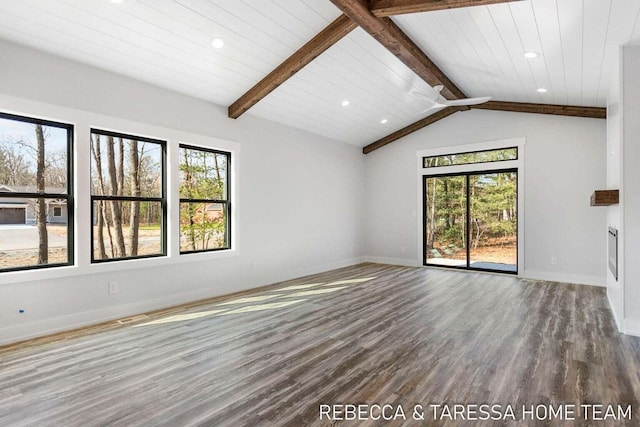 unfurnished living room featuring wood ceiling, a healthy amount of sunlight, lofted ceiling with beams, and wood-type flooring