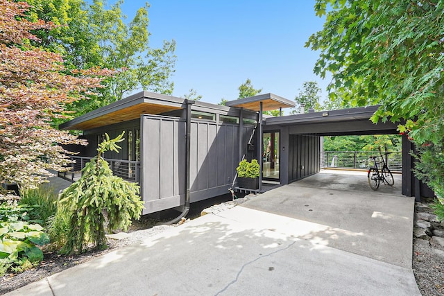 exterior space with an attached carport and driveway