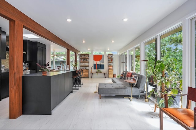 sunroom / solarium featuring a sink