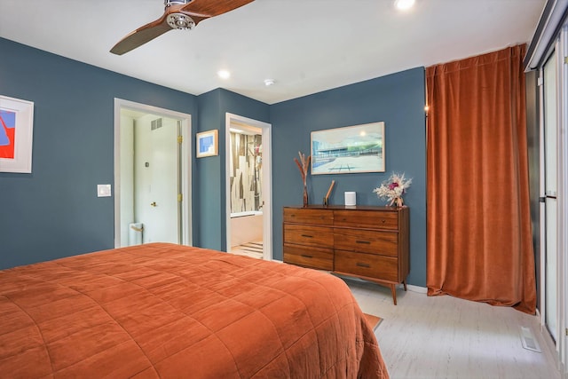 bedroom featuring a ceiling fan, visible vents, and light wood-style flooring