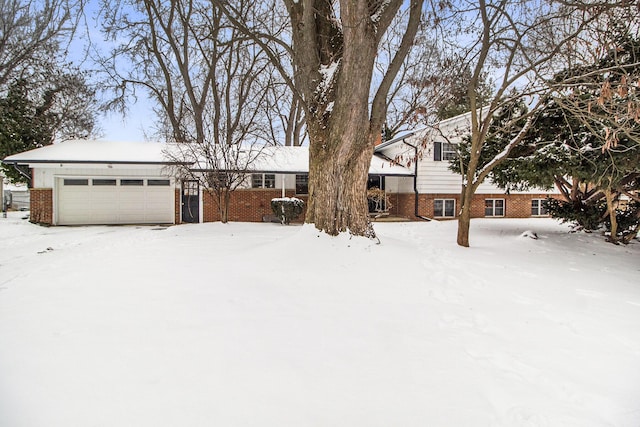 yard covered in snow with a garage