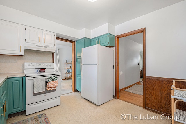 kitchen featuring white appliances and white cabinets