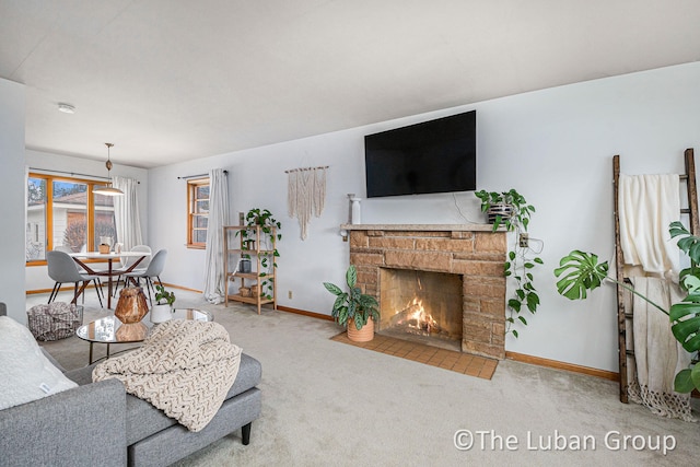 living room featuring a fireplace and carpet flooring