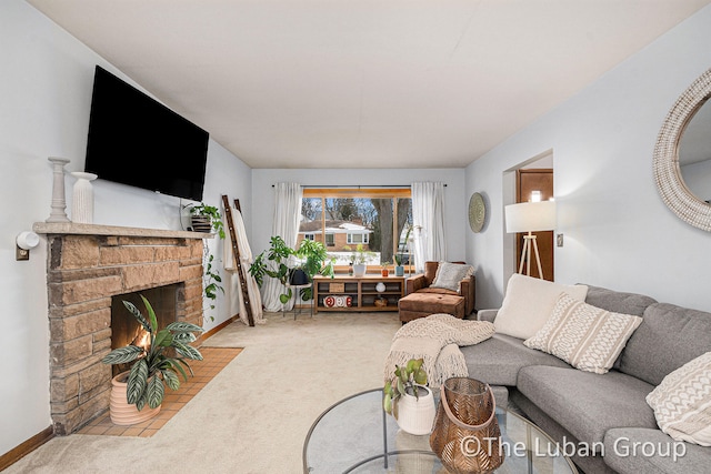 carpeted living room featuring a fireplace