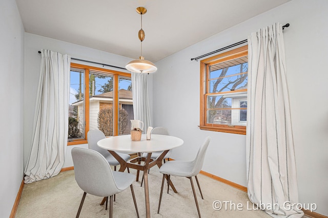 dining area with light colored carpet