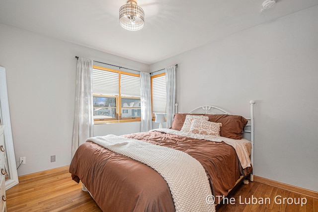 bedroom with light wood-type flooring