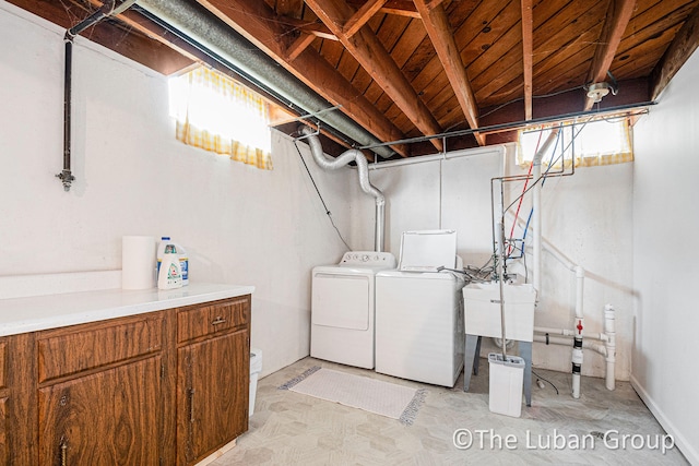 washroom with sink and washing machine and dryer