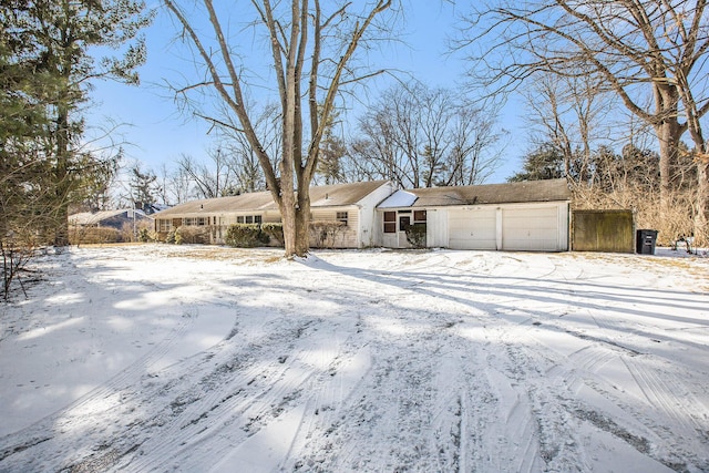 ranch-style house featuring a garage