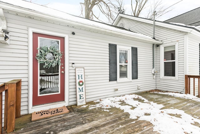 view of snow covered property entrance