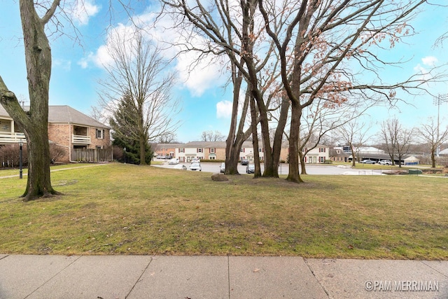 view of yard featuring a residential view