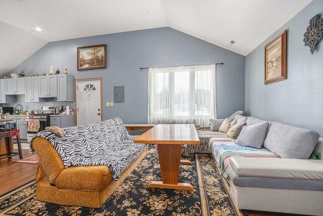 37076 76th St, Covert, MI 49043 - living room with visible vents, electric panel, wood finished floors, and vaulted ceiling