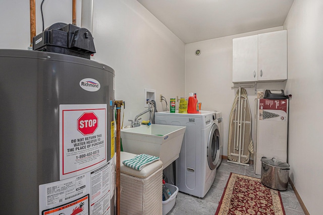 37076 76th St, Covert, MI 49043 - washroom with cabinet space, washing machine and clothes dryer, a sink, water heater, and baseboards