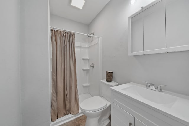 bathroom featuring vanity, a shower with curtain, wood-type flooring, and toilet