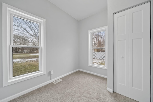 view of carpeted spare room