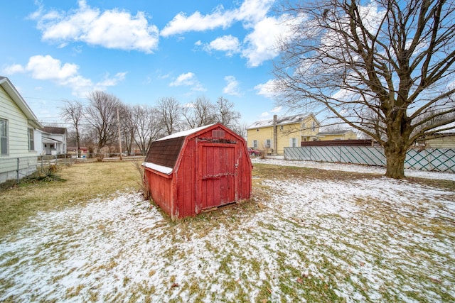 snow covered structure featuring a lawn